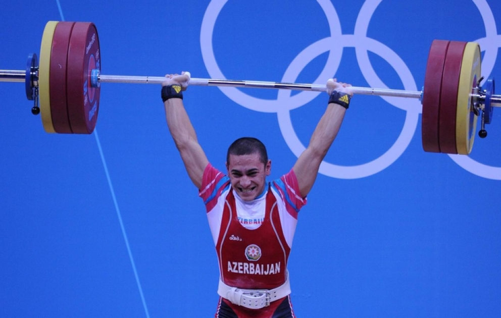 Azerbaijan claims first Olympic medal President Ilham Aliyev watches the action