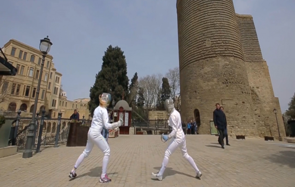 Fencing Olympic champion Olga Kharlan performs in Baku streets