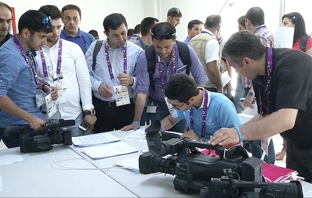 Media representatives receive badges for Baku-2015