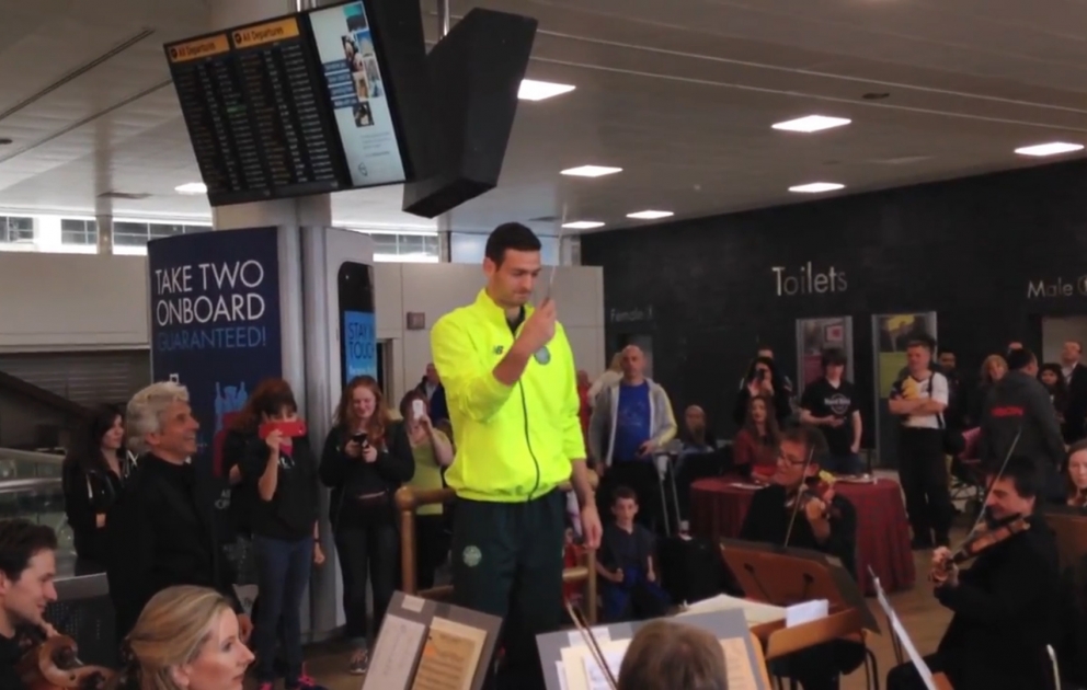 Before arriving in Baku Celtic club football player conducts at Glasgow airport ​