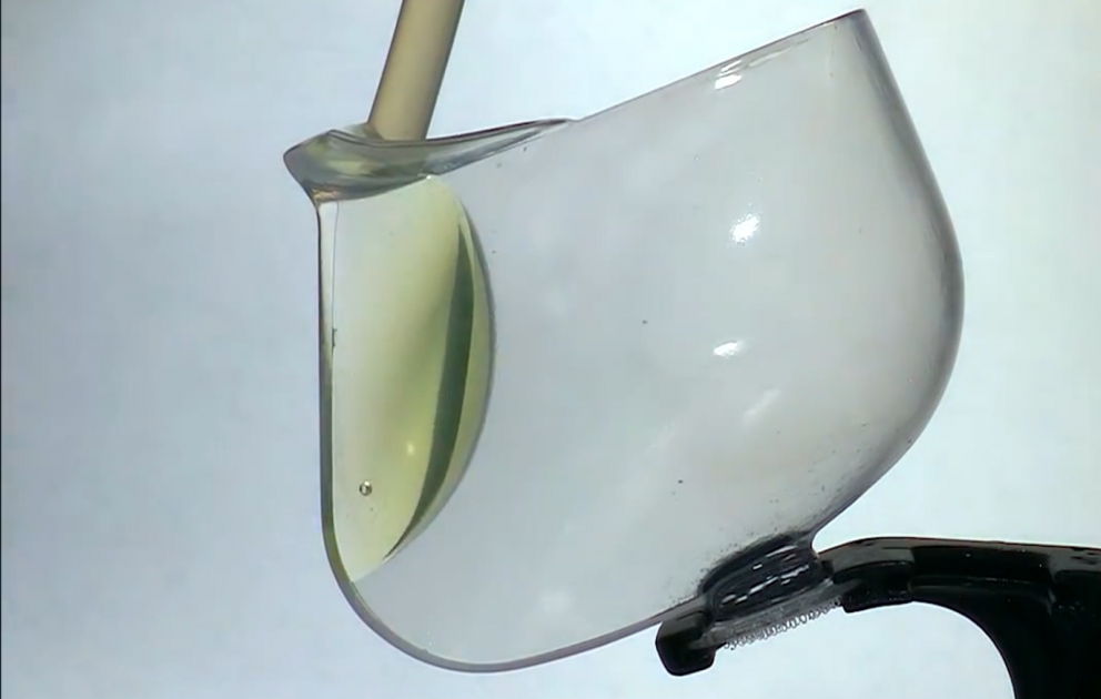 NASA video: glass filled with liquid in zero gravity