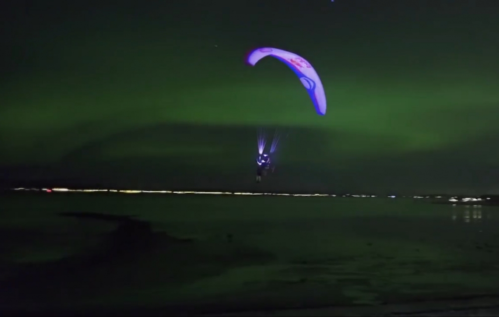 Breathtaking Paraglide Flight Through Aurora Borealis