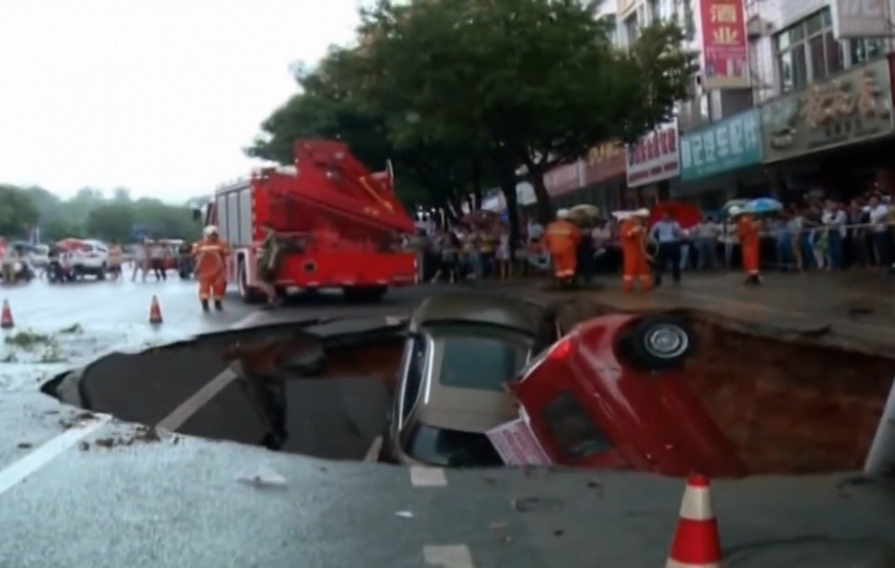 Another sinkhole emerges, swallowing up four cars in China