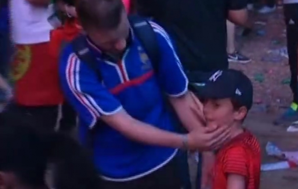 Portuguese boy consoles crying French fan