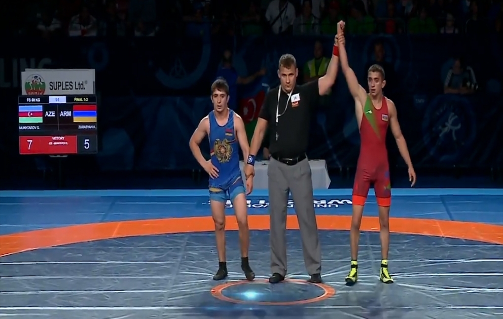 Azerbaijani wrestler beats Armenian rival to claim world gold