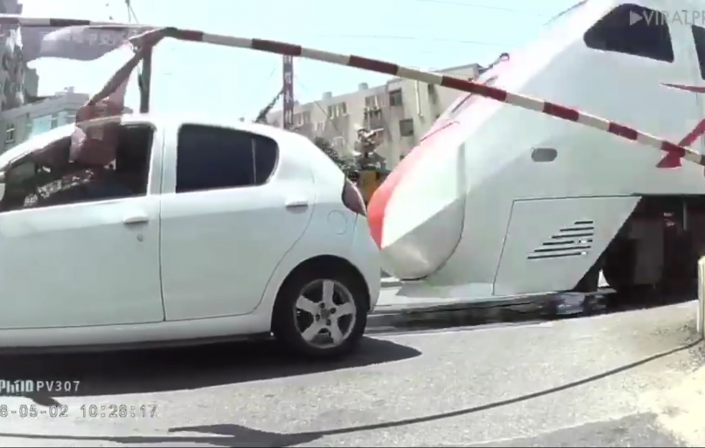 Car stalled on a level crossing, crashed into train