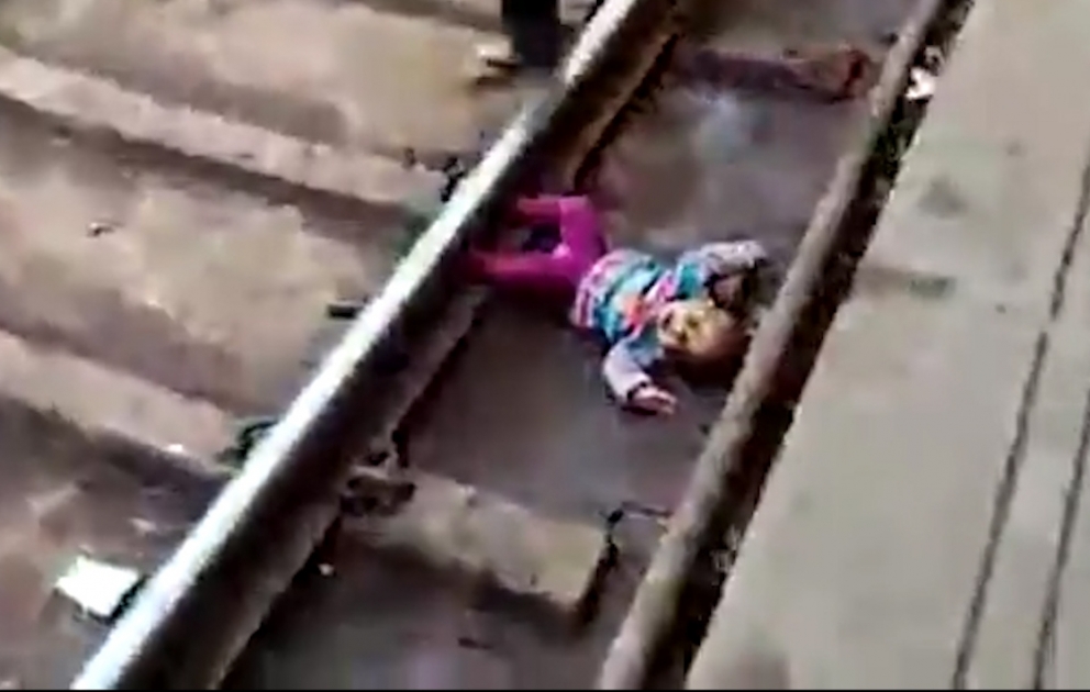 1-year-old girl survives after train passes over her