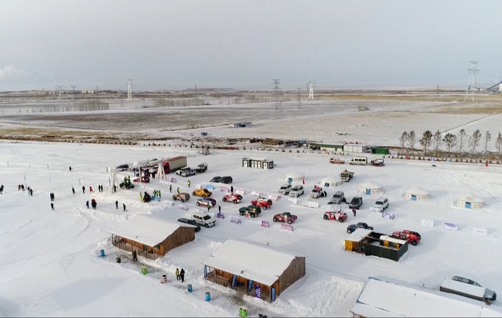 Car drift racers display stunts on ice in China