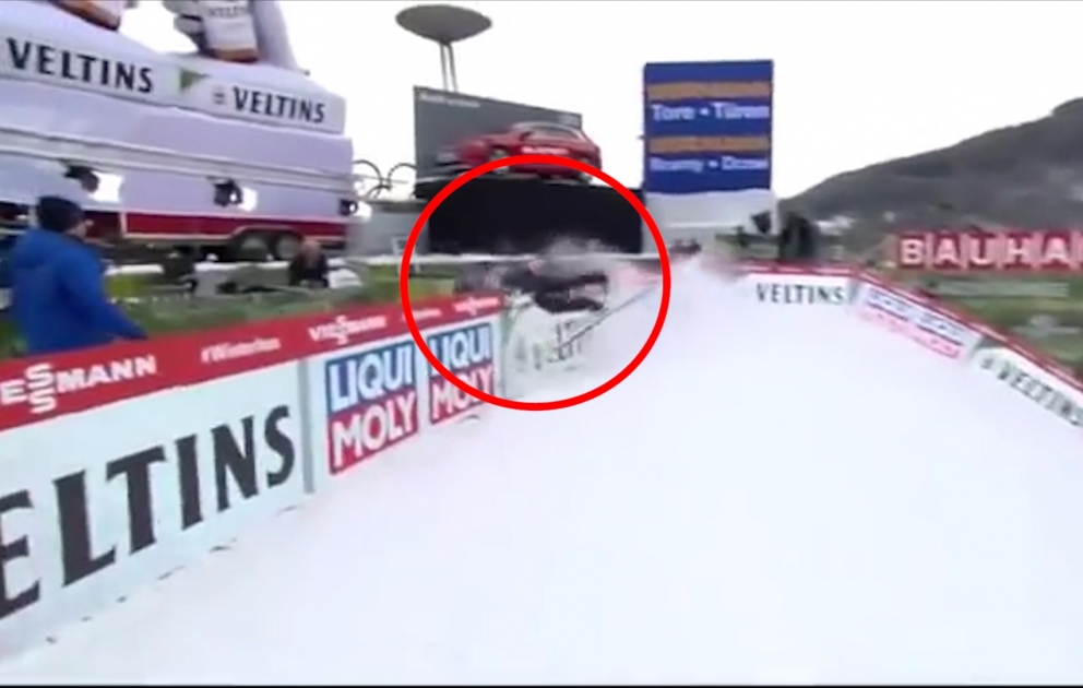 Kazakh skier crashes into road barrier during race