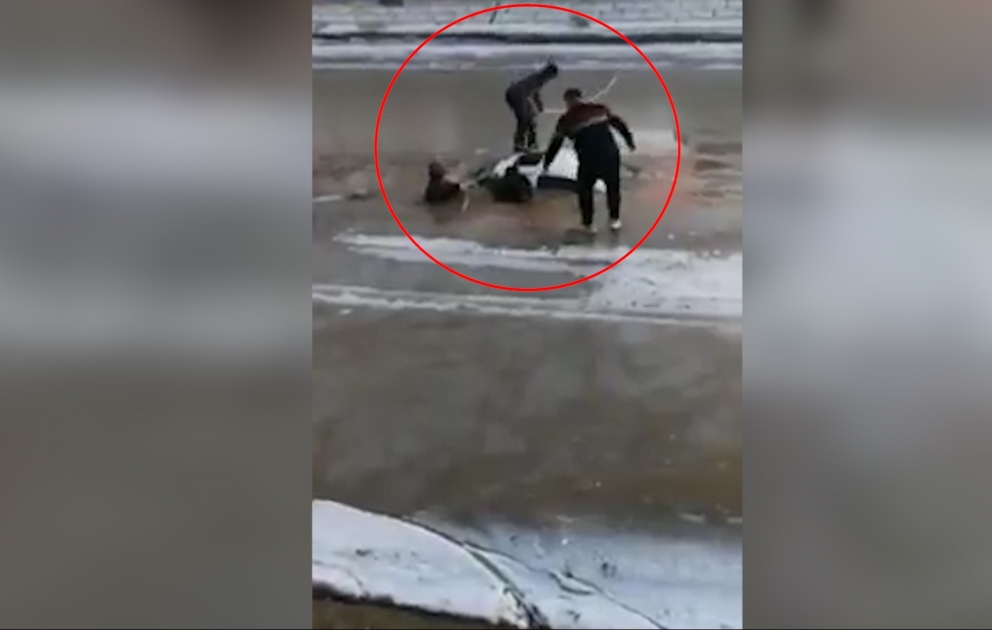 Villagers save man trapped in car that fell into icy river