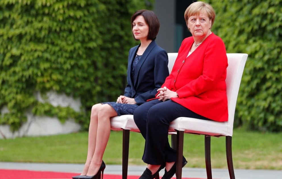 Merkel once again sits through national anthem