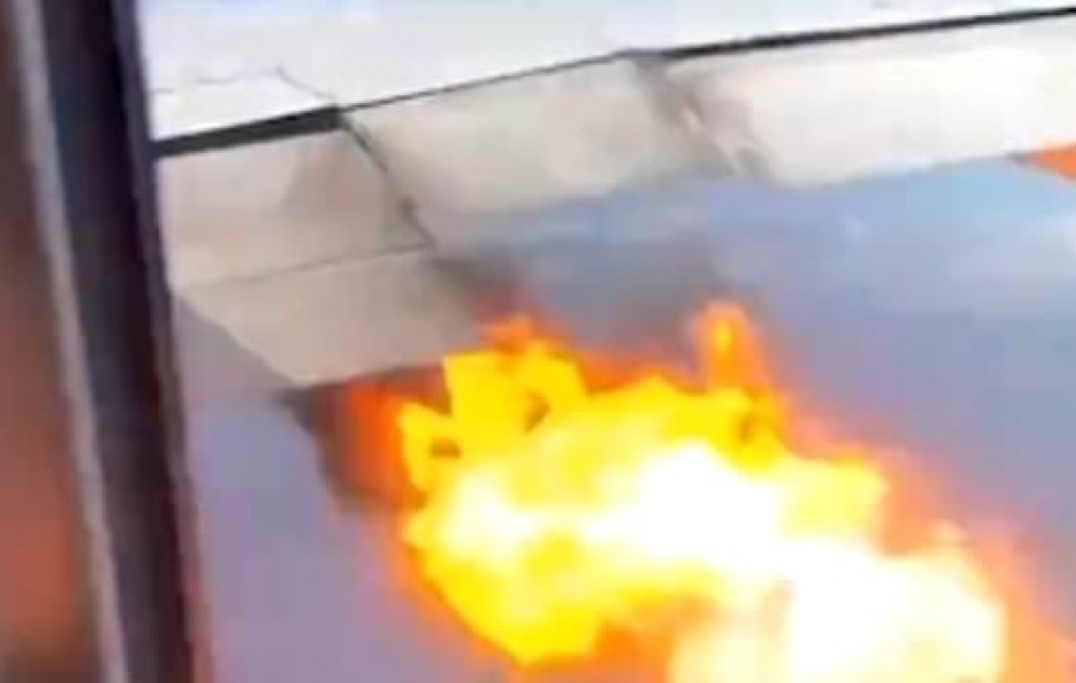 Terrifying moment passengers in plane see flames erupt from engine