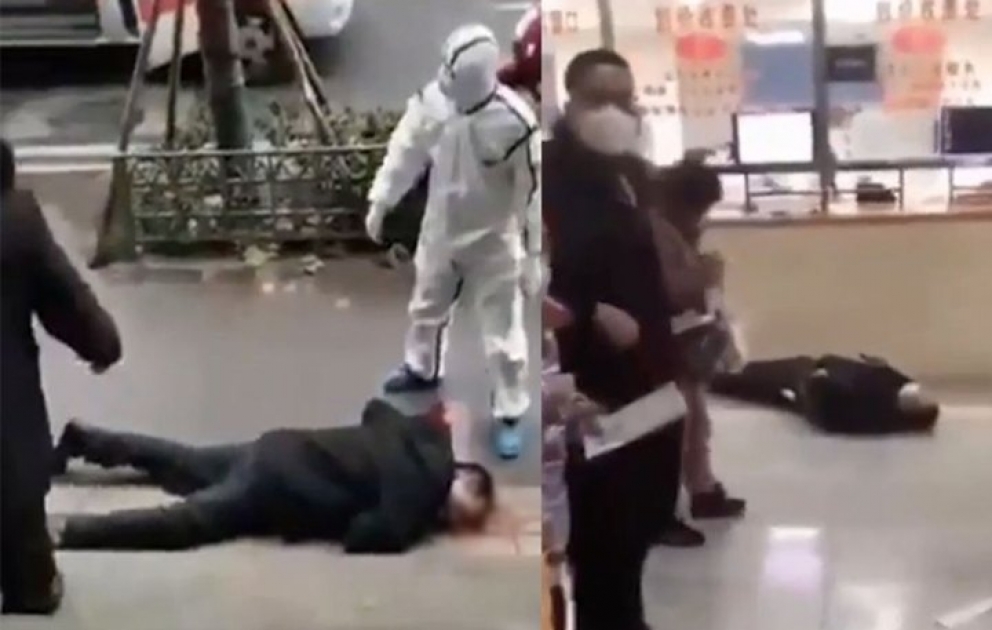 Virusa yoluxan insanların küçədə yıxıldığı anların görüntüləri yayıldı