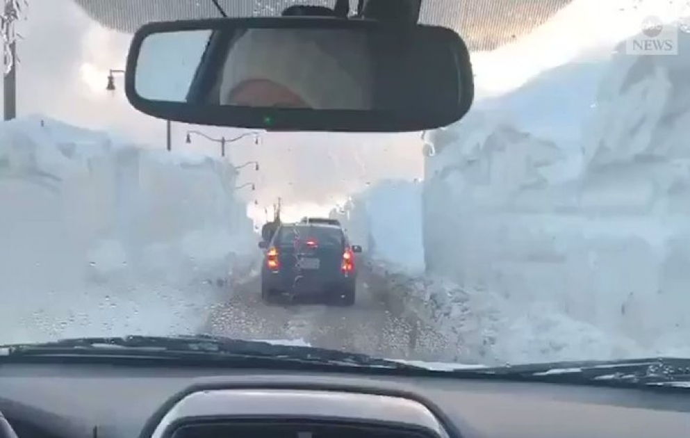 Commuters in Newfoundland navigated through a snow "tunnel" while driving through the city, following a record-breaking blizzard in the region.
