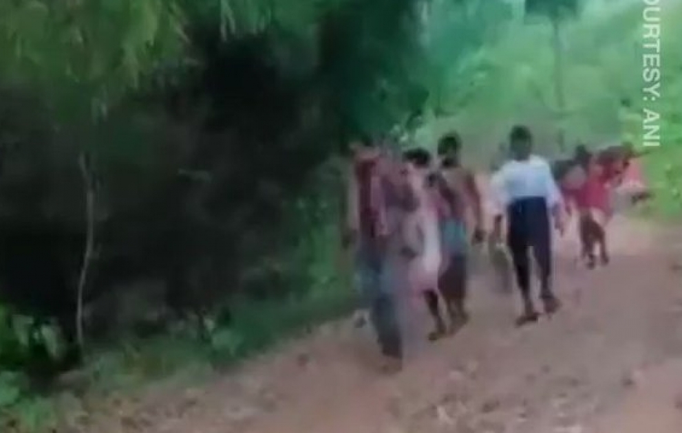 Indian villagers carry sick man 12km on makeshift stretcher to ambulance due to lack of roads