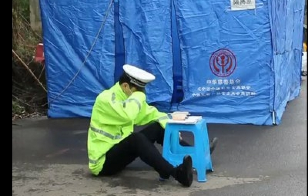 Video of an auxiliary police officer wiping tears from his face goes viral on social media