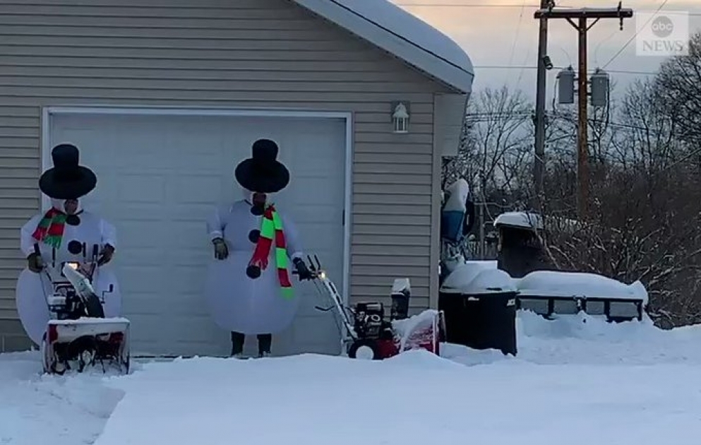 ‘Snowmen’ use snow blowers to clear powder in Wisconsin