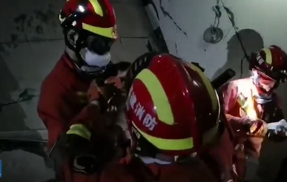 A child aged two or three years old was rescued after hotel collapse in east China