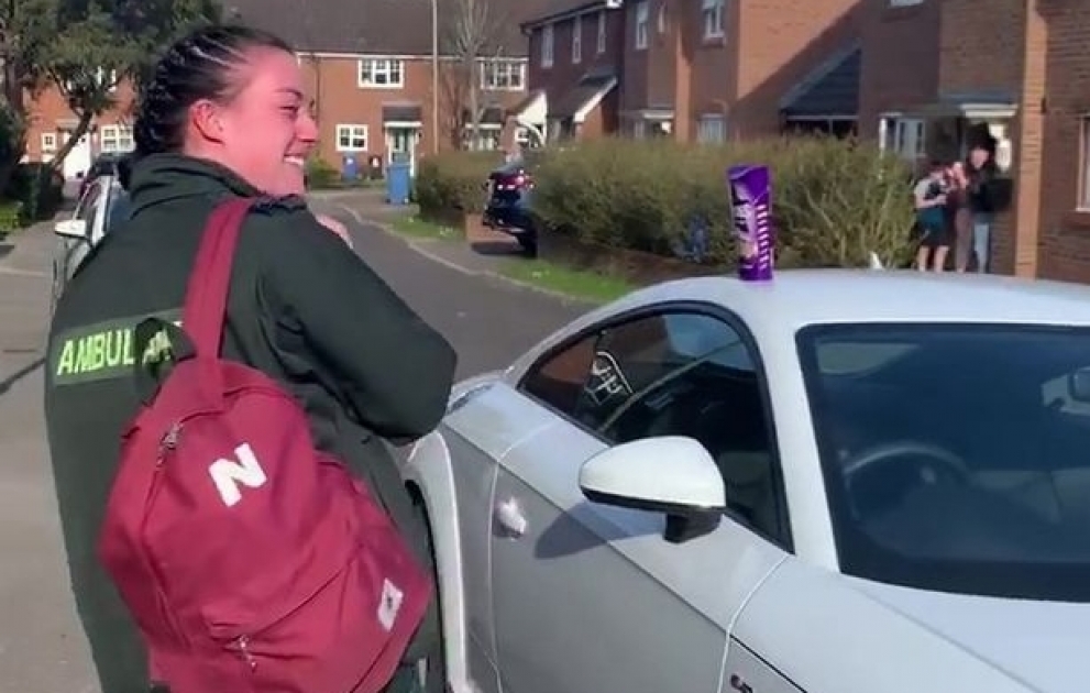 A young ambulance worker burst into tears as her entire street come out to applaud her on the way to work on Thursday night