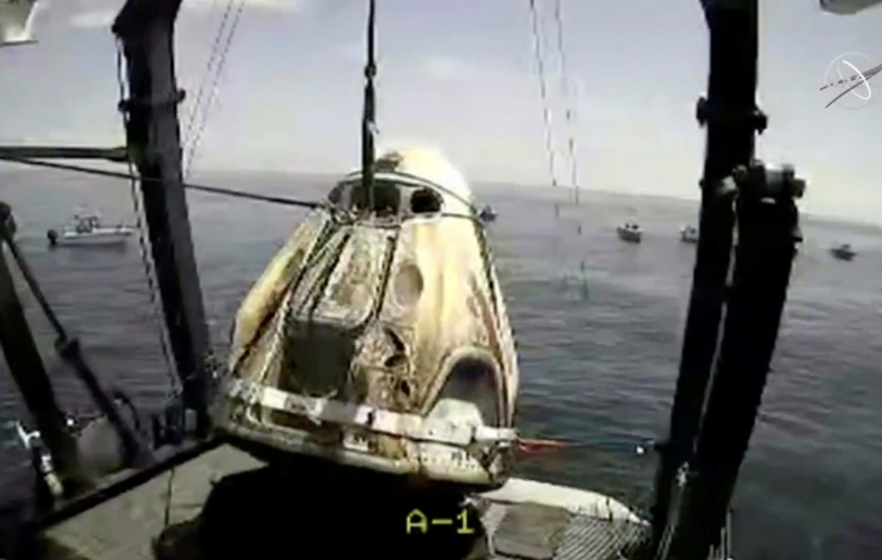 NASA astronauts exit SpaceX Dragon Capsule after a splashdown