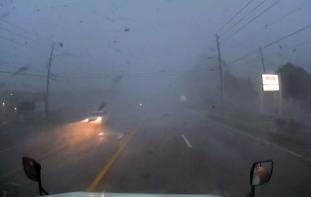 Tornado Turns over Truck on Highway