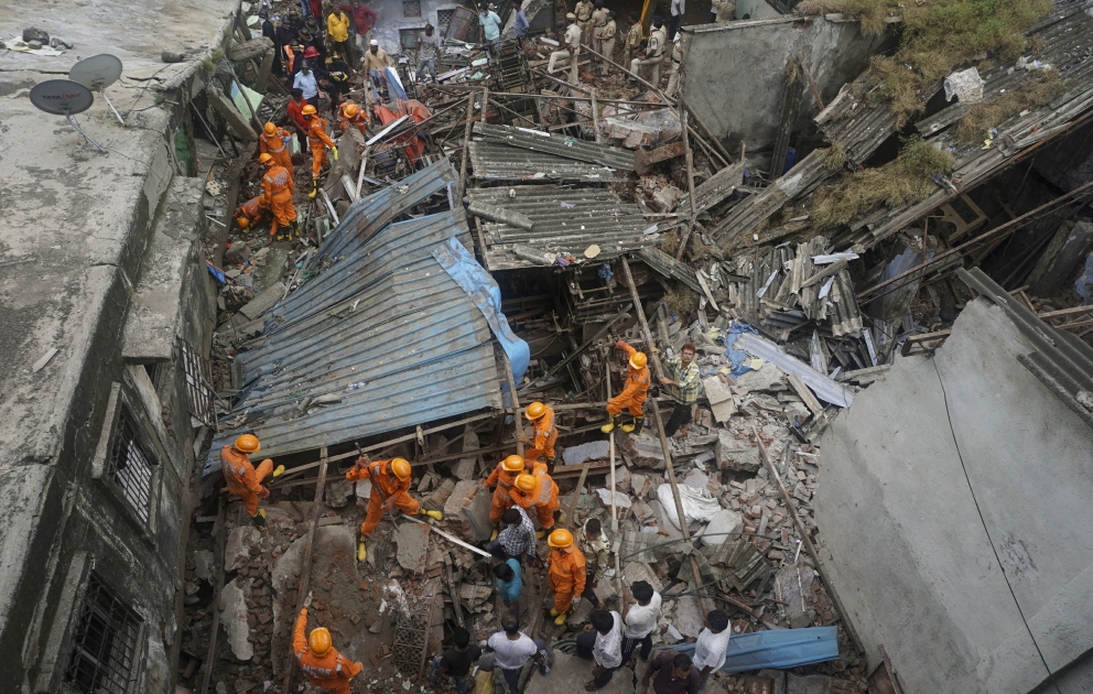 At least 10 dead in residential building collapse in India