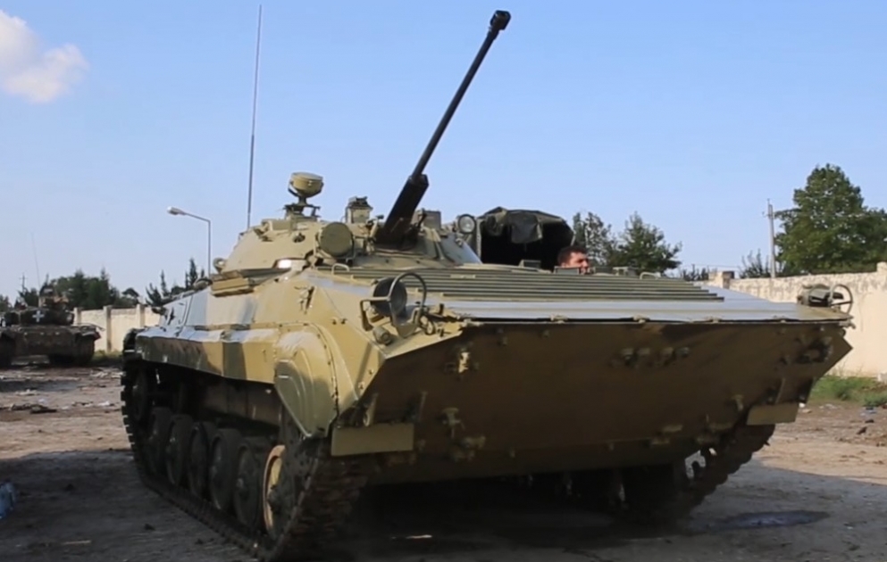 Armored vehicles abandoned by the enemy are being repainted in the color of military equipment of the Azerbaijan Army