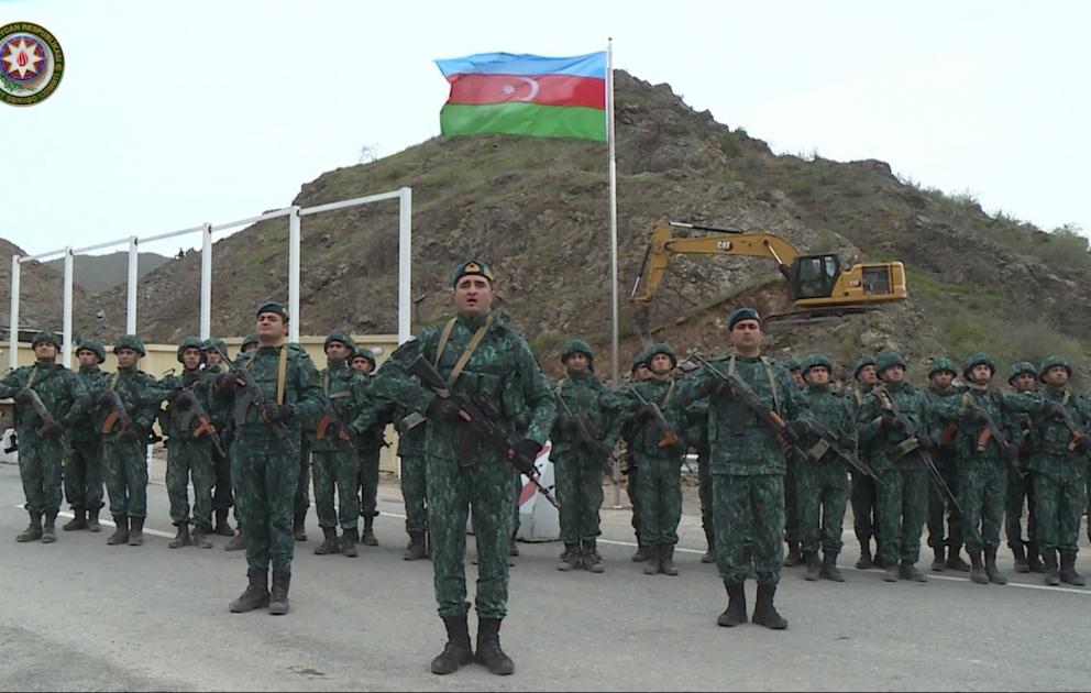 Azerbaijani border guards report to President Ilham Aliyev from checkpoint on Lachin-Khankendi road, hoist national flag