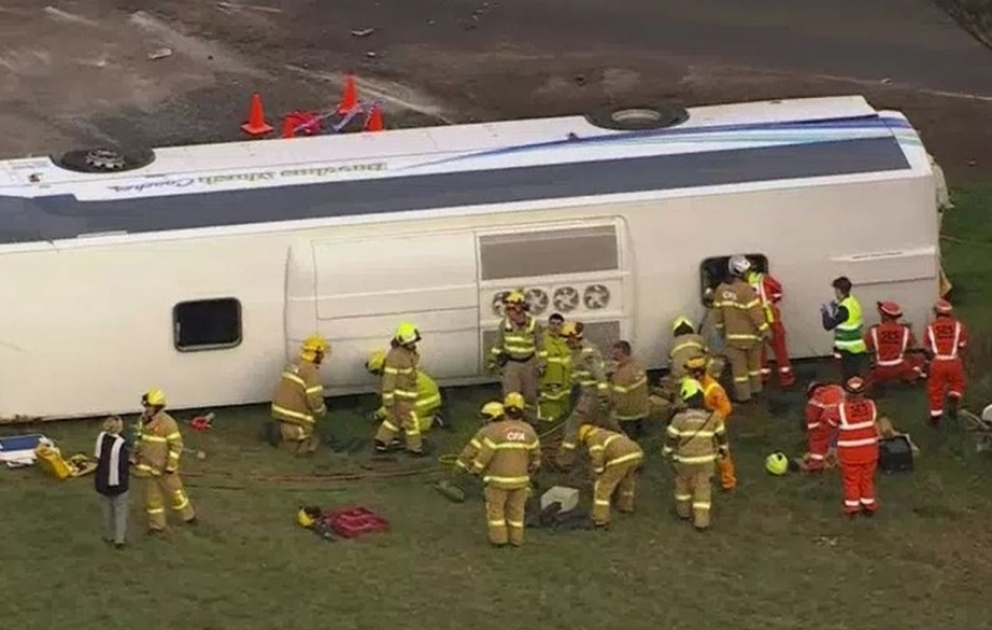 School bus full of children flips after collision with a truck