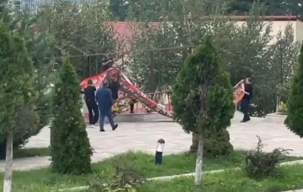 Stand of Armenian terrorists' photos being demolished in Azerbaijan's Khankendi