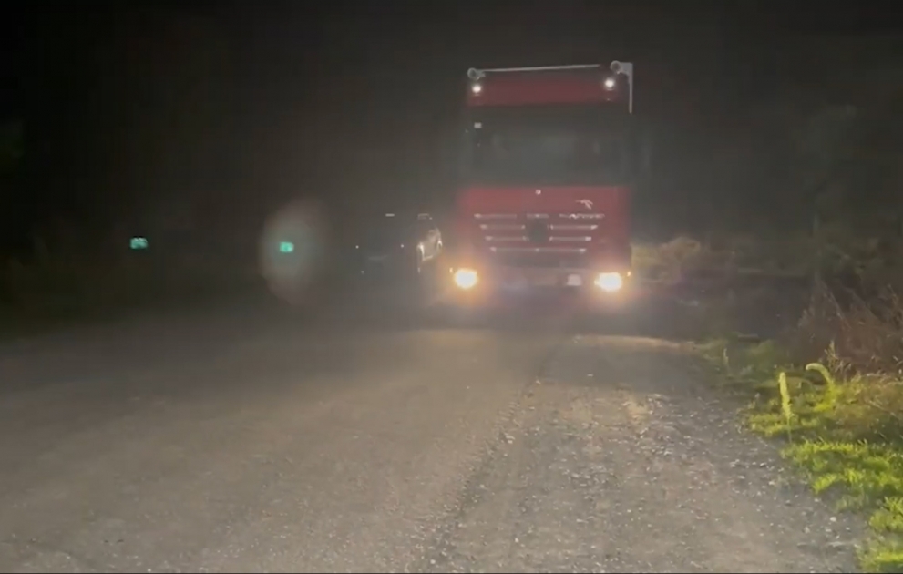 Vehicles delivering foods and sanitary products for Armenian residents of Karabakh return after unloading their cargo