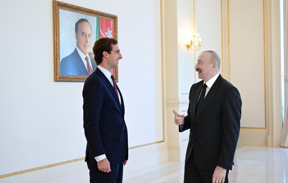 President Ilham Aliyev shows commemorative gift from President Donald Trump to U.S. Assistant Secretary of State